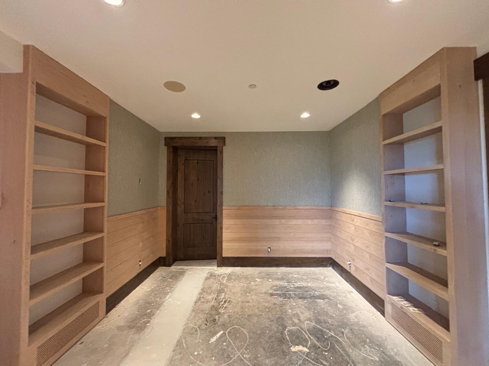 Warm neutral wallpaper and woodwork in a room