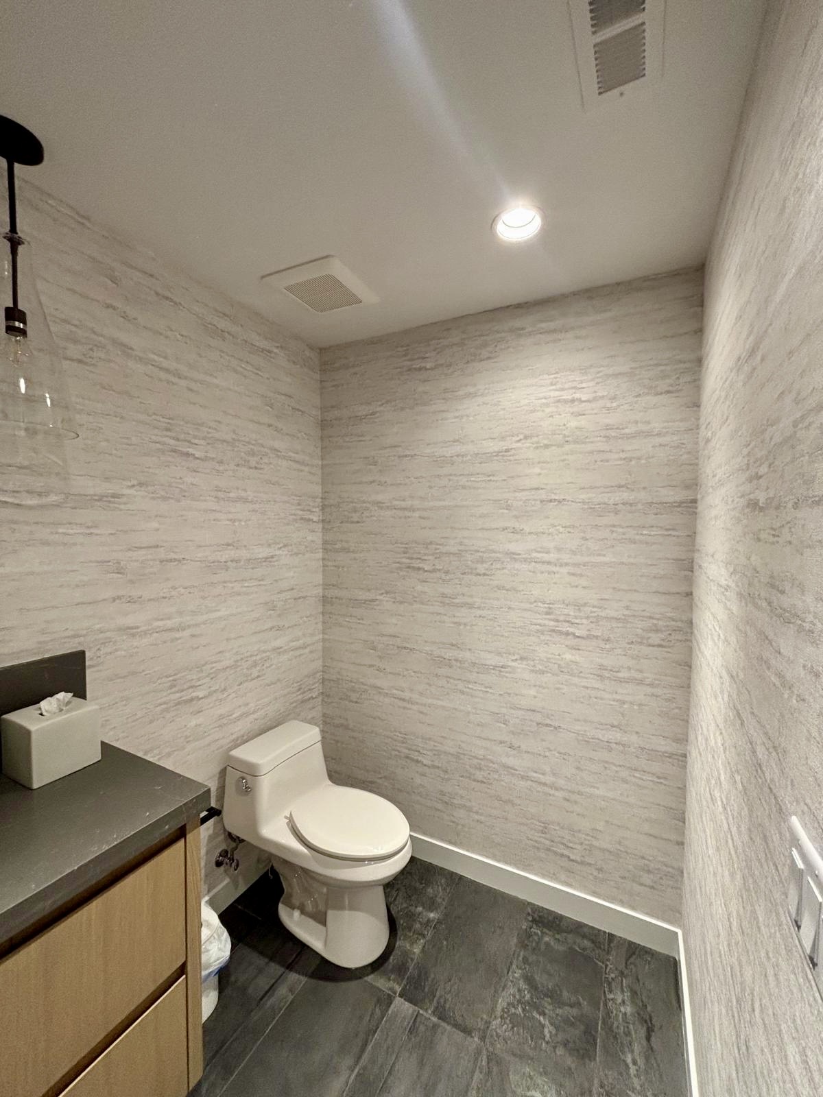 Light textured wallpaper in a bathroom